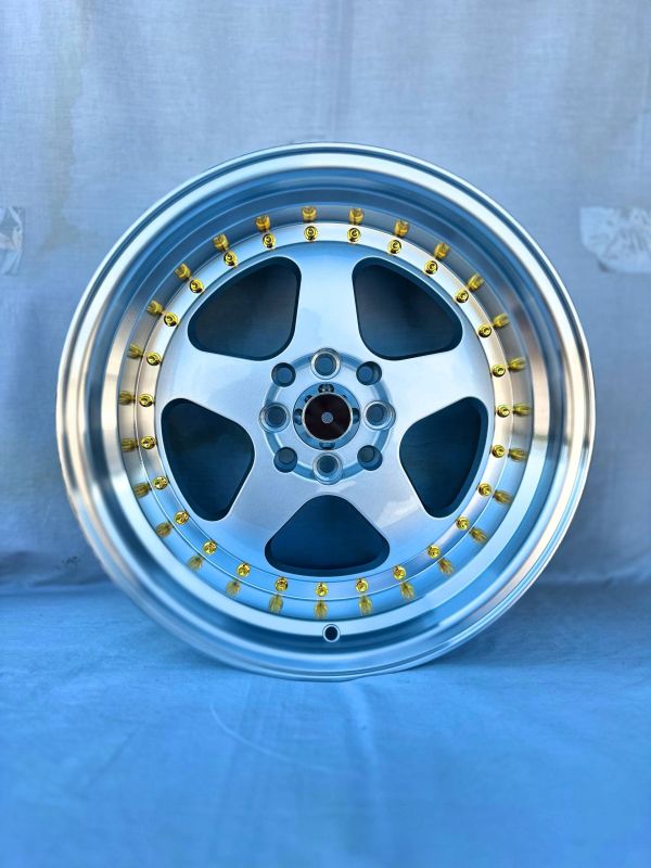 6089R	R16 9J	ET15	4x100 / 4x114,3	73,1	Silver Polish Lip Gold Rivets